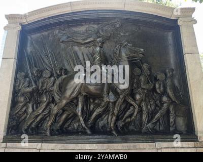 The Memorial to Robert Gould Shaw and the Massachusetts Fifty-Fourth Regiment, a bronze relief by Augustus Saint-Gaudens, honors Colonel Shaw and the Stock Photo