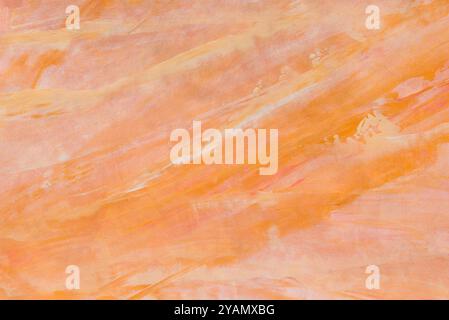 orange color painted background on paper texture Stock Photo