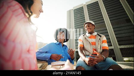 Outdoor, friends and laughing with conversation in city with joke, bonding and fun on campus as university students. People, fashion and happy or Stock Photo