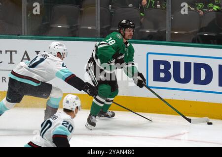 Dallas, United States. 13th Oct, 2024. Sam Steel #18 of Dallas Stars and Ryker Evans #41 of Seattle Kraken skating on the ice while battle for the puck during the NHL match between Dallas Stars and the Seattle Kraken at American Airlines Center. Final score Dallas Stars 2-0 Seattle Kraken. on October 13, 2024 in Dallas, Texas. (Photo by Javier Vicencio/Eyepix Group) Credit: Eyepix Group/Alamy Live News Stock Photo