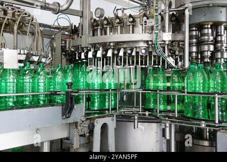 Automatic conveyor line with plastic bottles at the mineral water production plant Stock Photo