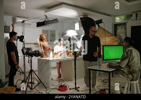 Team Of Operators And Photographers Working In Studio Stock Photo