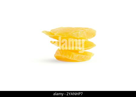 Slices of large sweet dried mangoes isolated on white. Stock Photo