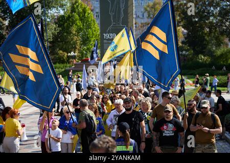 Large demonstration in Ukraine. Flags of 3rd Assault Brigade and Azov Brigade on a peaceful rally in memory of the fallen soldiers. Kyiv - 28 September,2024 Stock Photo