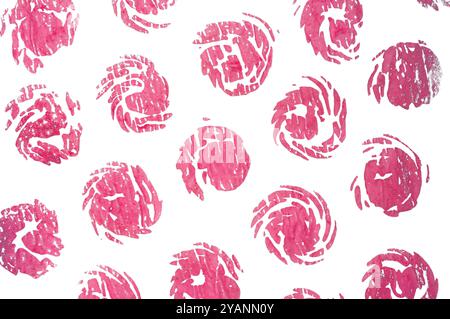 Abstract pink circular prints on a white background resembling floral patterns. Stock Photo