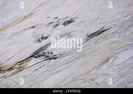 Premium white marble surface with natural veining, perfect for interior applications. Stock Photo