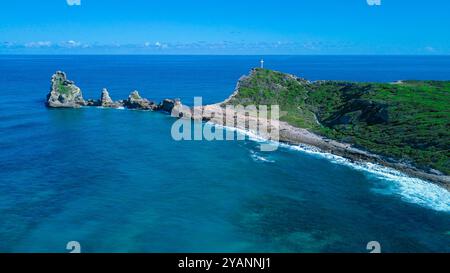 Aerial View to the Green Coast of the Pointe des Chateaux beach under the blue cloudy sky, Guadeloupe island Stock Photo