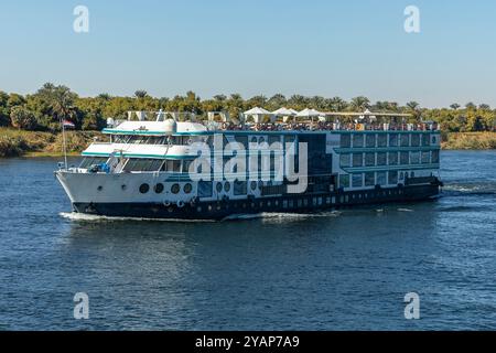 Aswan, Egypt; January 17, 2024: Experience the ultimate in relaxation as you cruise down the Nile River surrounded by countless other boats. Enjoy the Stock Photo