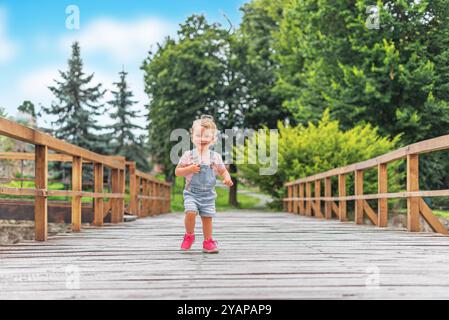 A small child on a bridge. Stock Photo