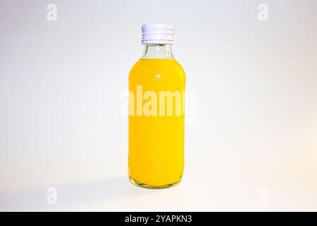 Orange juice bottle. Organic orange or lemon juice in plastic or glass bottle. Stock Photo