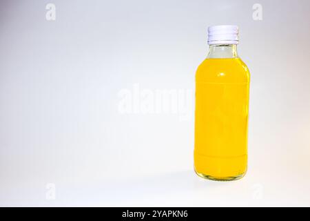 Orange juice bottle. Organic orange or lemon juice in plastic or glass bottle. Stock Photo