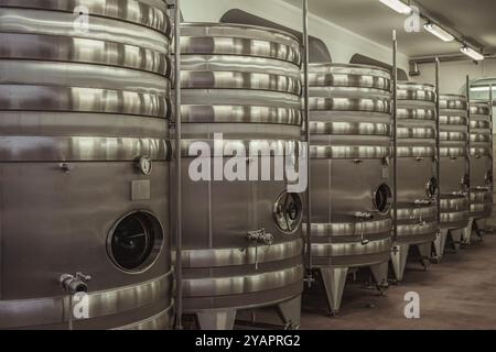 Metal Wine tanks, wine fermentation at the manufacture Stock Photo