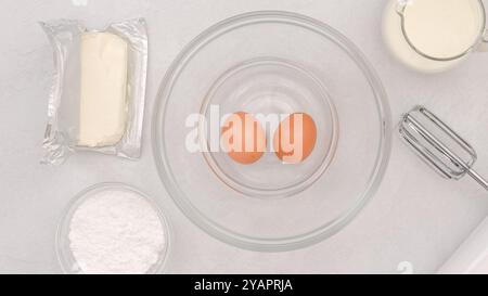 Cream cheese whipped cream recipe. Ingredients close-up on a kitchen table, baking process Stock Photo
