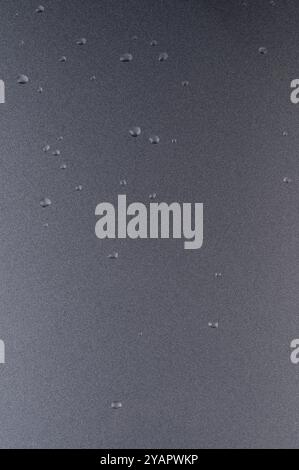 Metallic grey shiny background with water drops close up view Stock Photo