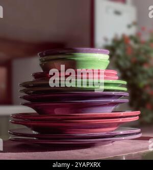Still life of a stack of colorful plates Stock Photo