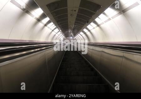 Moving escalator in subway station Stock Photo