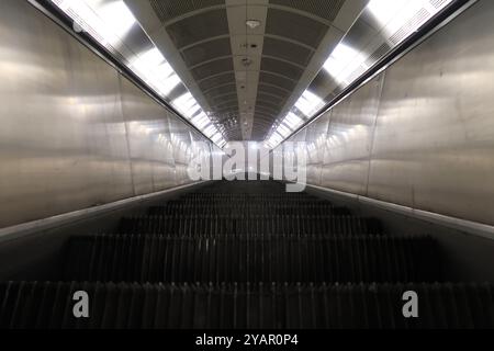 Moving escalator in subway station Stock Photo