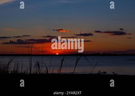 Dramatic Sunset on Colorful Skies At Joe Pool Lake Stock Photo