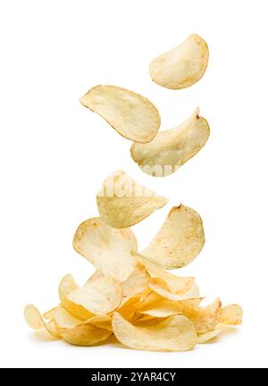 Potato chips falling on pile on white background. Stock Photo