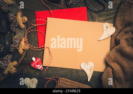 Scene for gifts in Advent with cookies, gift ribbon and card for text on dark wooden back ground, christmas concept. copy space, top view Stock Photo