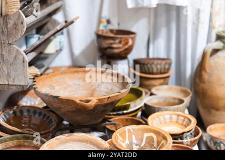 Vintage clay dishes are in a tourist shop in Kas, Turkey. Close up photo with selective soft focus Stock Photo