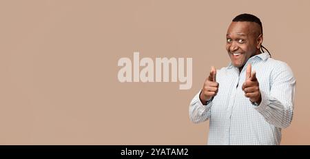 Middle aged african man pointing at camera Stock Photo