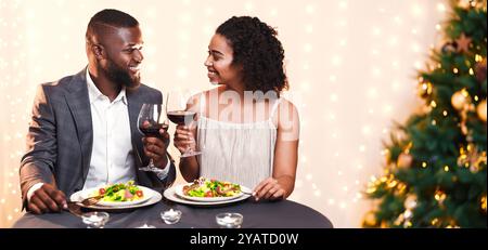 Beautiful black couple having romantic dinner in restaurant Stock Photo