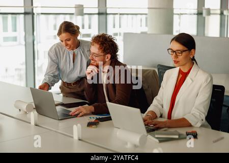 Engaging in Collaborative Work within a Contemporary Office Environment for Improved Outcomes Stock Photo