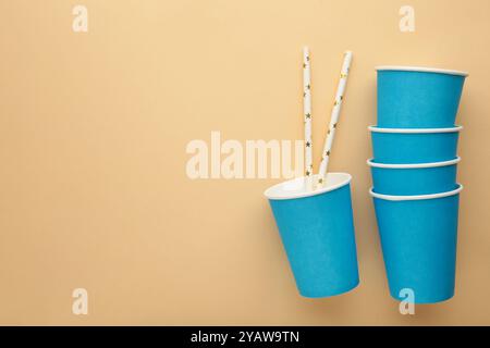 Paper disposable cup on beige background. Top view Stock Photo