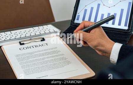 a businessman who writes contracts in the office Stock Photo