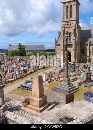 Brittany. The cemetery of the church of Louannec in the Cotes d'Armor, along the GR34, the famous customs officers' path.    BRITTANY, BRETON, COTES D'ARMOR, COTES DU NORD, WEST FRANCE, REGION, SEASIDE, MARITIME, NAVAL, TOURISM, TOURIST, TRAVELER, VACATIONER, HIKING, HIKER, WALKER, TREKKING, EXCURSION, VISIT, GR 34, CUSTOMS TRAIL, COASTAL TRAIL, TOWN, SEA RESORT, VILLAGE, RELIGION, BELIEF, CATHOLIC, CATHOLICISM, CHURCH, CULT, CHRISTIAN, CHRISTIANITY, CEMETERY, GRAVES, BURIALS, DEATH credit:MHRC/Photo12 Stock Photo