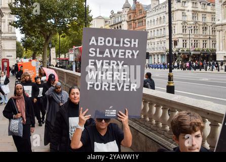 London, UK. 15th October 2022. Walk For Freedom participants in Whitehall. Thousands of people worldwide have joined the day of action, with participants walking in line and carrying placards in various cities to raise awareness of human trafficking. Credit: Vuk Valcic/Alamy Stock Photo