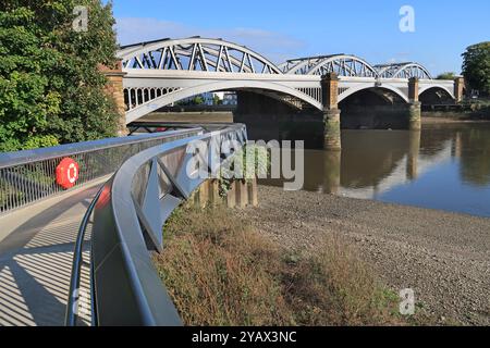 The new Dukes meadows footbridge, Chiswick, London, UK. Carries the Thames path under Barnes Railway Bridge on the north bank. Opened January 2023. Stock Photo