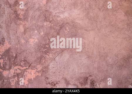 Texture of old rustic wall covered with pink stucco. Abstract background for design Stock Photo
