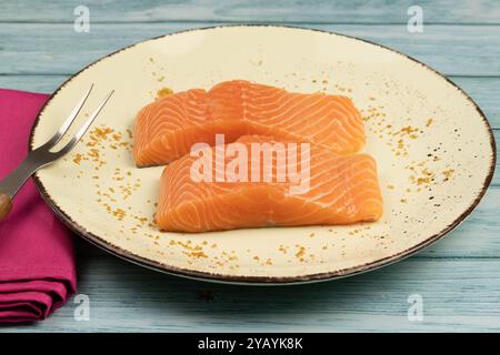 raw salmon fillets on a plate Stock Photo