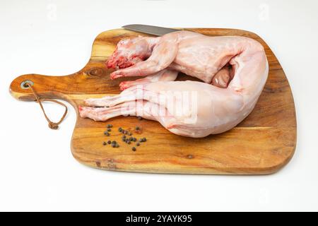 whole rabbit, ready to cook, on a cutting board Stock Photo