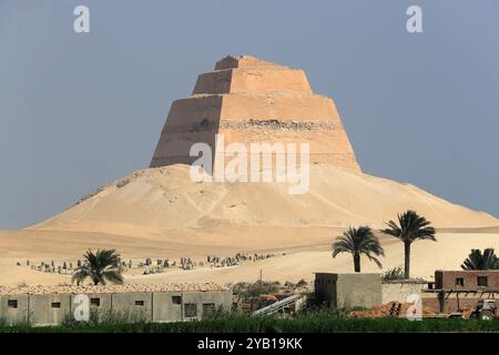 Beni Suef. 16th Oct, 2024. This photo taken on Oct. 16, 2024 shows a view of the Meidum Pyramid in Beni Suef Governorate, Egypt. Meidum Pyramid is thought to be built by Pharaoh Sneferu, the first pharaoh of the Fourth Dynasty of ancient Egypt. The pyramid has a history of around 4,600 years. Credit: Sui Xiankai/Xinhua/Alamy Live News Stock Photo