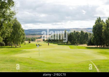 People playing golf on Strathmore Golf Course near  Alyth, Perth and Kinross, Scotland Stock Photo