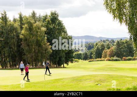 Ladies on a putting green on Strathmore Golf Course near  Alyth, Perth and Kinross, Scotland Stock Photo