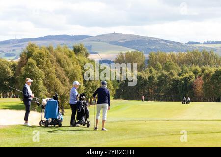 ladies playing golf on Strathmore Golf Course near  Alyth, Perth and Kinross, Scotland Stock Photo