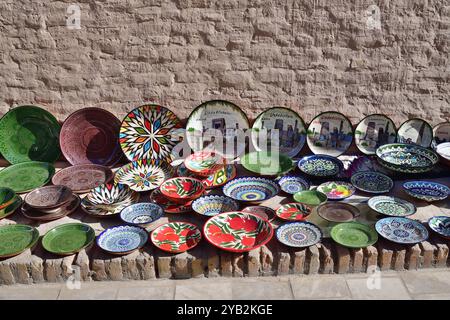 Khiva, Uzbekistan - Sept 12, 2024: Sale of traditional Uzbek ceramic plates at Khiva street Stock Photo
