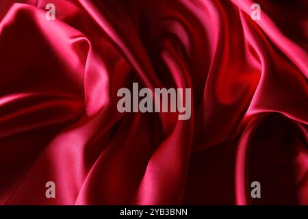 Ripples in red silk fabric Stock Photo