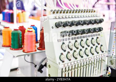 Embroidery industrial machine in sewing workshop Stock Photo