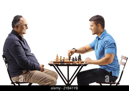 Father and son playing chess isolated on white background Stock Photo