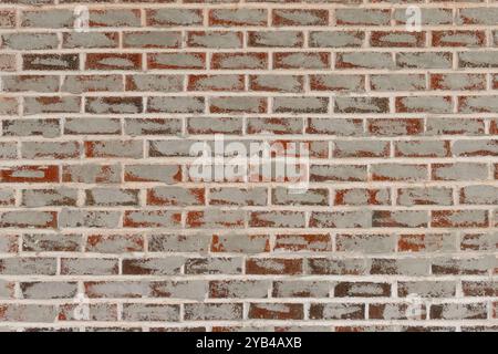 Red brick background that has grey paint pattern full copy space. Full frame Red brick background that has grey paint repair pattern for full copy spa Stock Photo