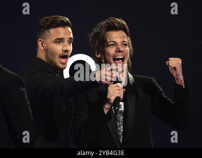 File photo dated 19/02/14 of (L-R) One Direction's Liam Payne and Louis Tomlinson with their award for Best British Video during the 2014 Brit Awards at the O2 Arena, London. Liam Payne has died after falling from the third floor of a hotel in Buenos Aires, according to local officials. He was 31. Issue date: Wednesday October 16, 2024. Stock Photo