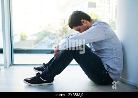 Depression, business and man in office, sad and mental health with emotion, burnout and upset. Person, employee and professional with reaction Stock Photo