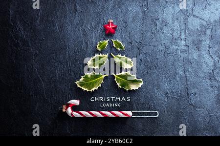 Christmas Loading Minimal Concept - Tree And Candy Canes On Dark Background Stock Photo