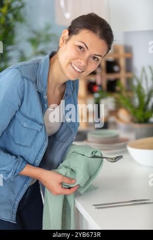 young woman in kitchen during quarantine Stock Photo