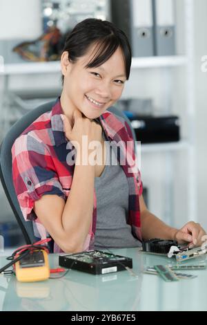 young woman working in an office Stock Photo